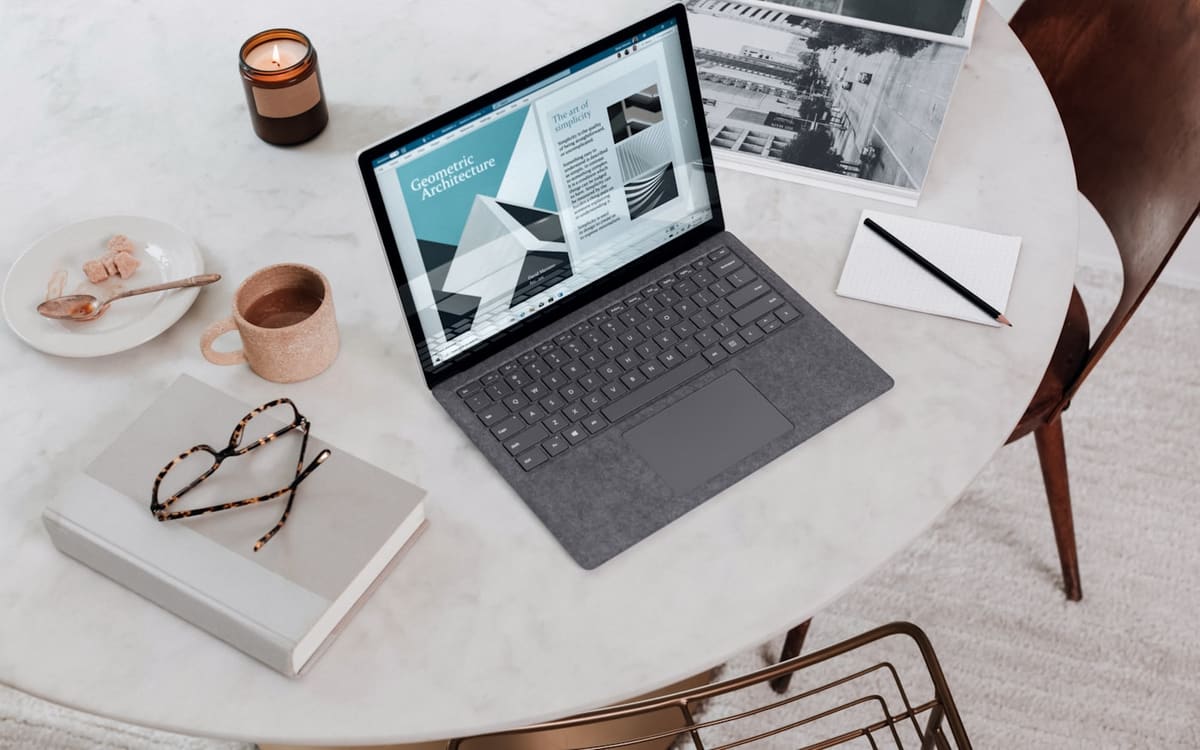 AI Max for Search campaigns dashboard on a laptop in an office