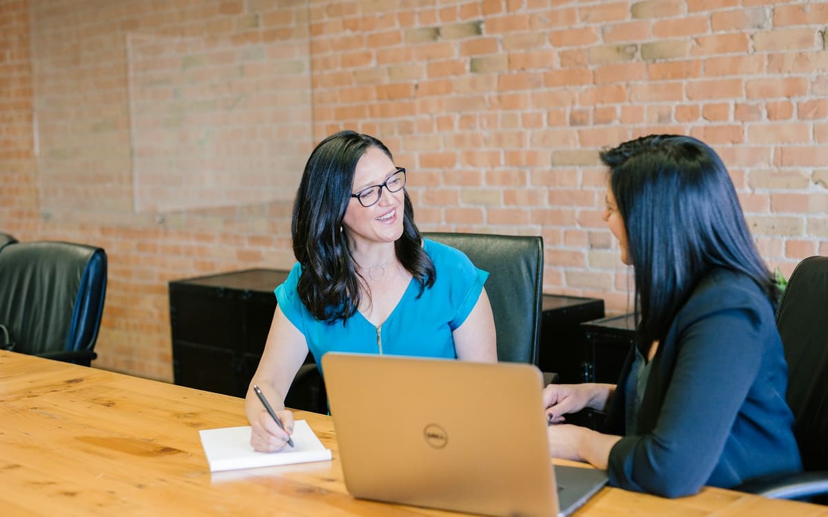 Marketing meeting around laptops
