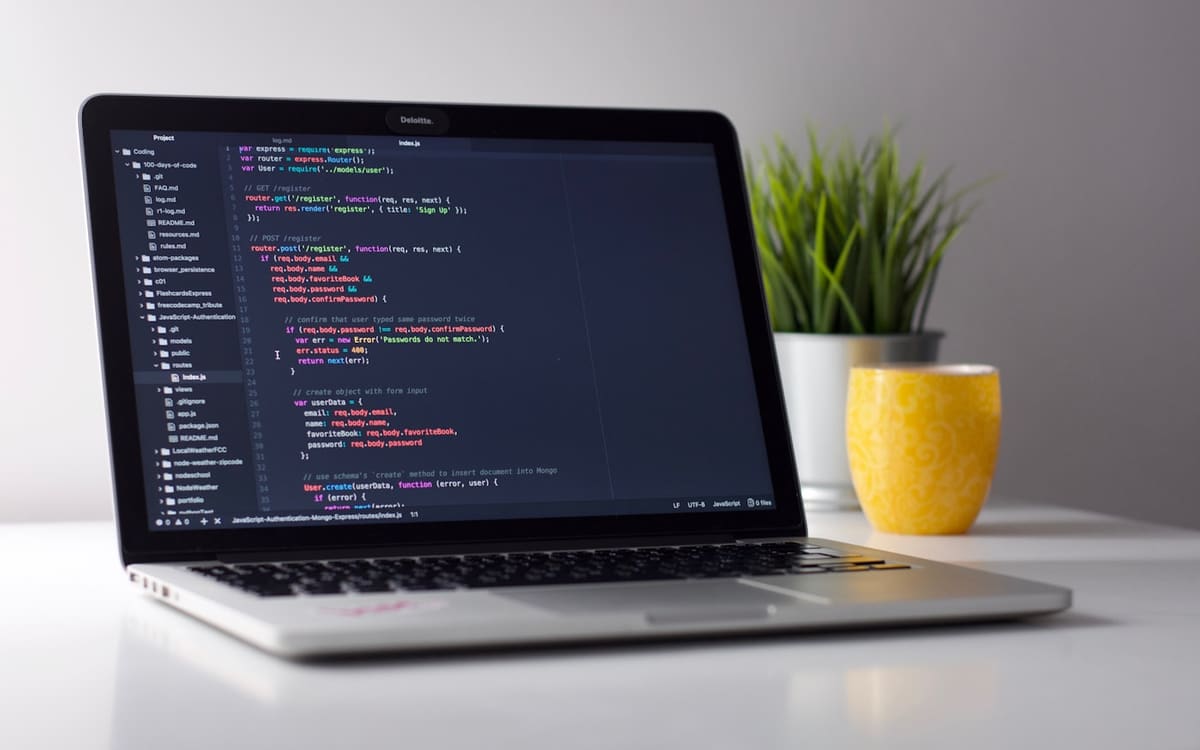 Theme code on a monitor during Shopify theme blocks work
