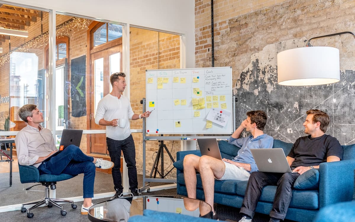 Website wireframes on paper next to a keyboard